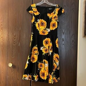PUKAVT capped black dress with large sunflowers. Size Medium.